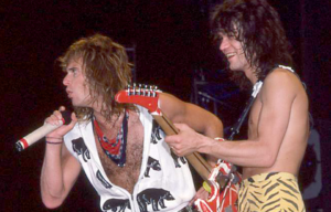 David Lee Roth (L) and Eddie Van Halen of Van Halen perform on May 21, 1984 in San Diego