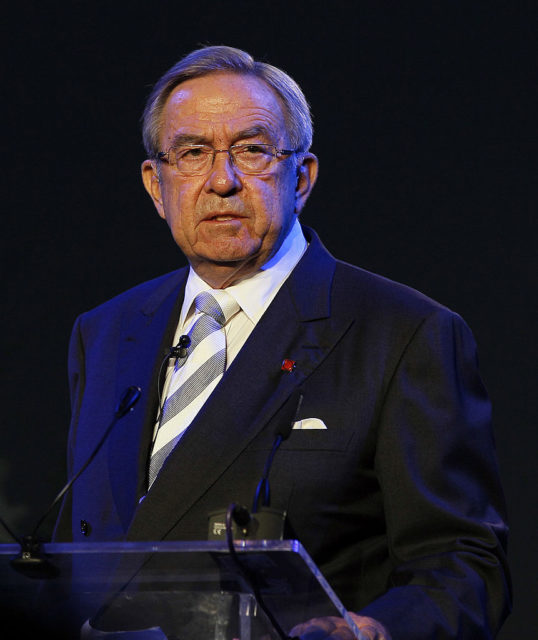 King Constantine II speaking at a podium