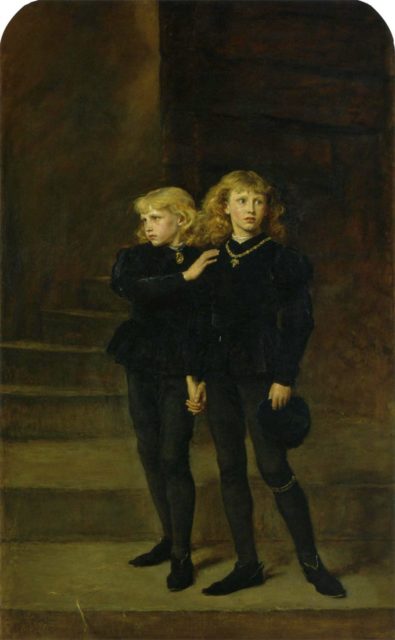 Two blond princes wearing all black clothing hold onto each others arms.