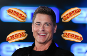 Headshot of Rob Lowe with four hotdogs surrounding his head