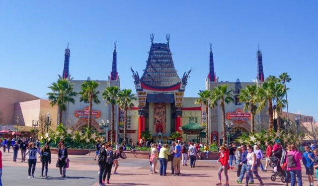 People gathered out front of a Graumann's Chinese Theater replica at Disney World