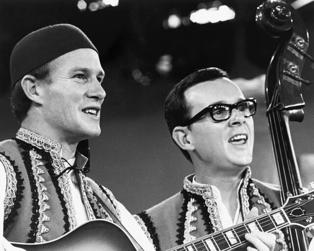 The Smothers Brothers performing on stage