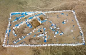 Aerial view of an archeological site outlined with stones.