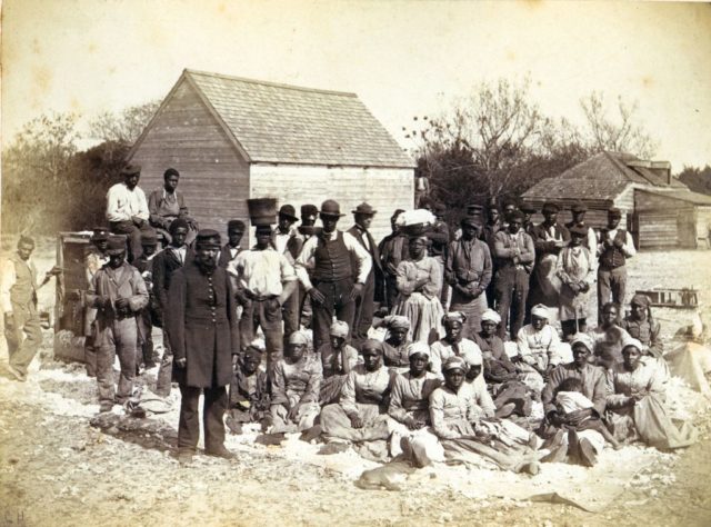 Slaves photographed with a Confederate soldier during the Civil War