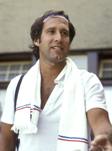 Headshot of Chevy Chase wearing a towel around his neck