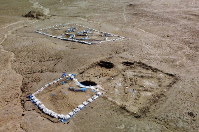 Aerial view of the tavern excavation with the site outlined with rocks.