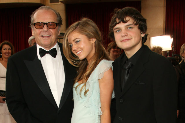 Jack Nicholson posing for photos with his daughter Lorraine and his son Ray.