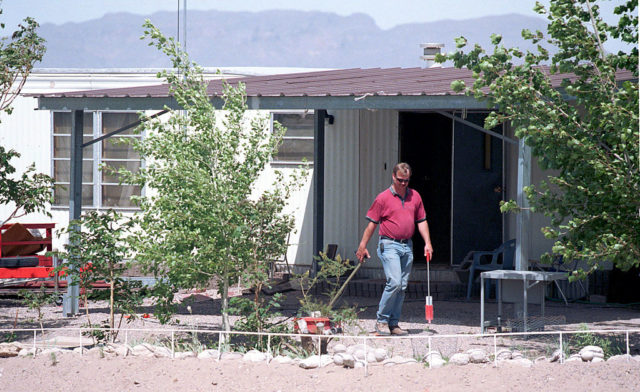 FBI investigator walks in front of David Parker Ray's trailer. 