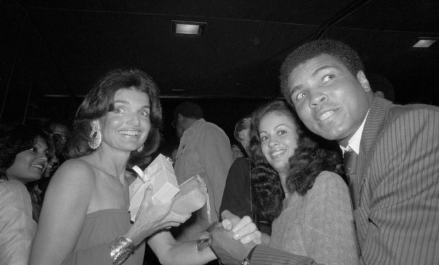 Jackie Kennedy, Veronica Ali, and Muhammad Ali posing for a photo together.