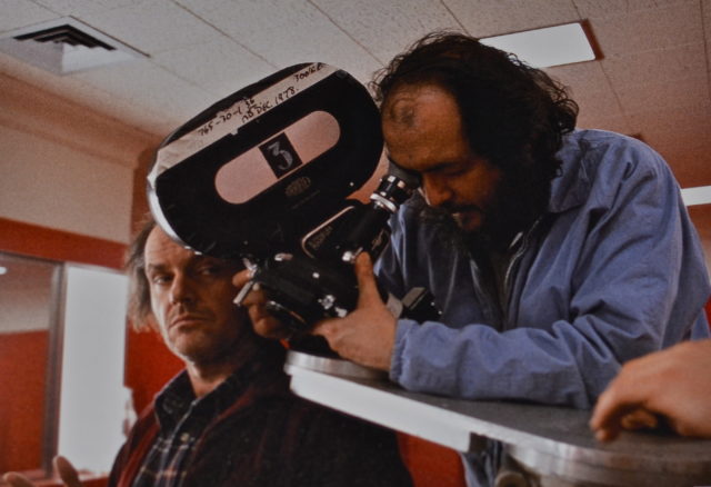 Stanley Kubrick holds a camera while next to Jack Nicholson during the filming of The Shining