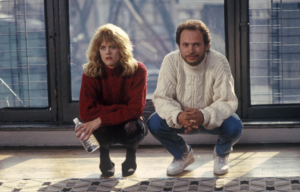 Meg Ryan and Billy Crystal crouching in a scene from "When Harry Met Sally"