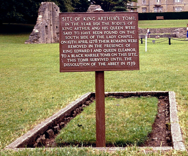 View of a grave with a marker saying it is the site of King Arthur's tomb.