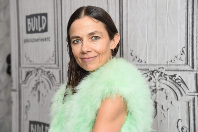 Headshot of Justine Bateman wearing a mint green fur vest.