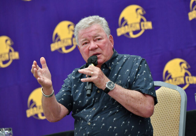 William Shatner speaking into a microphone.