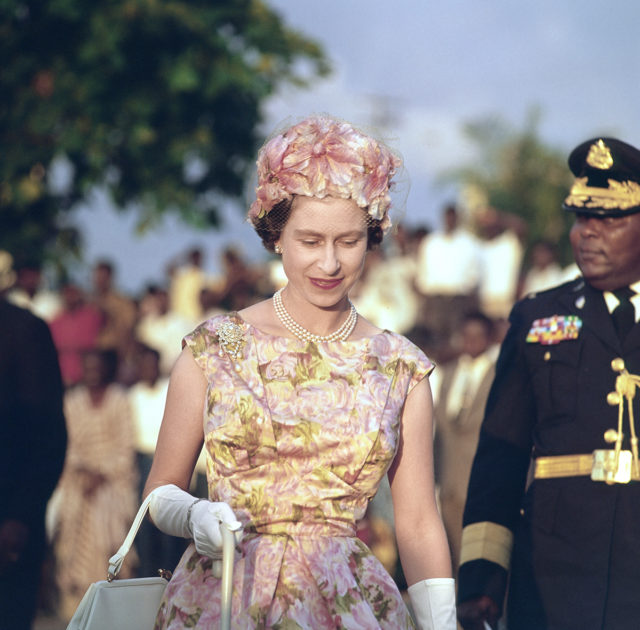 Queen Elizabeth as a young woman, wearing a floral ensemble