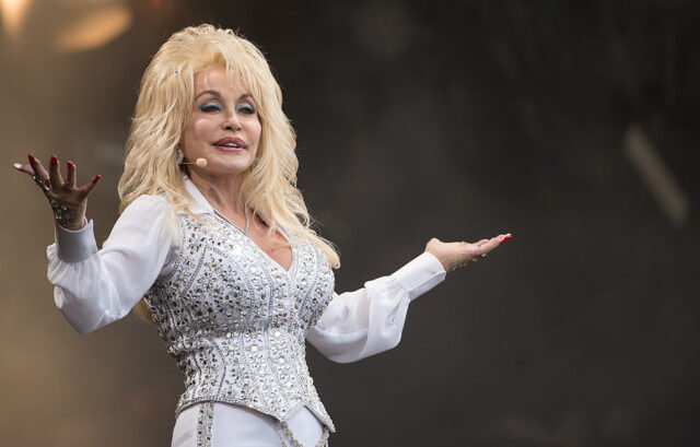 Dolly shrugs on stage
