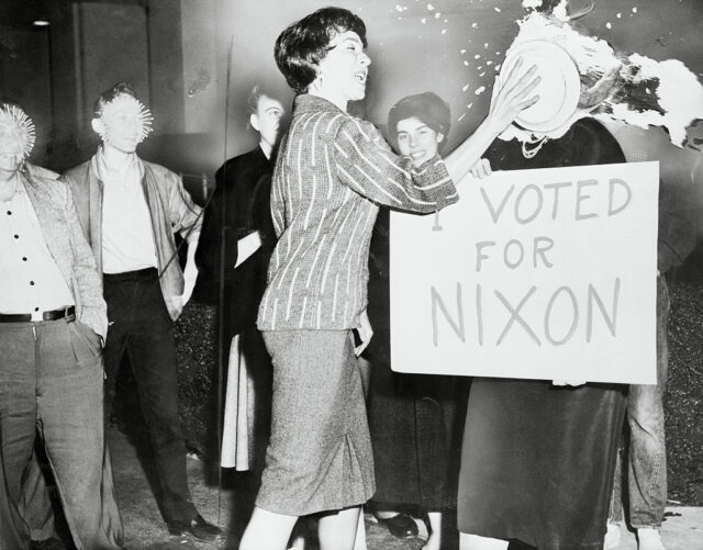 A Nixon supporter receives a pie in the face, 
