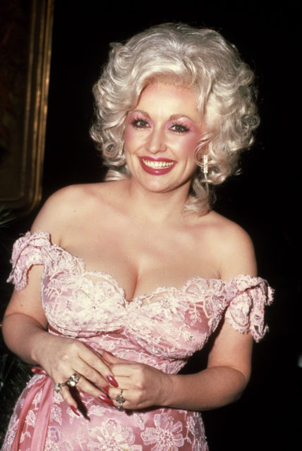 Dolly Parton circa 1981 wearing in a pink lace dress in New York City.