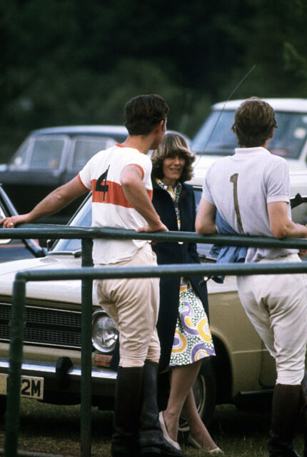 Young Camilla talks to Charles in polo gear at a mach.