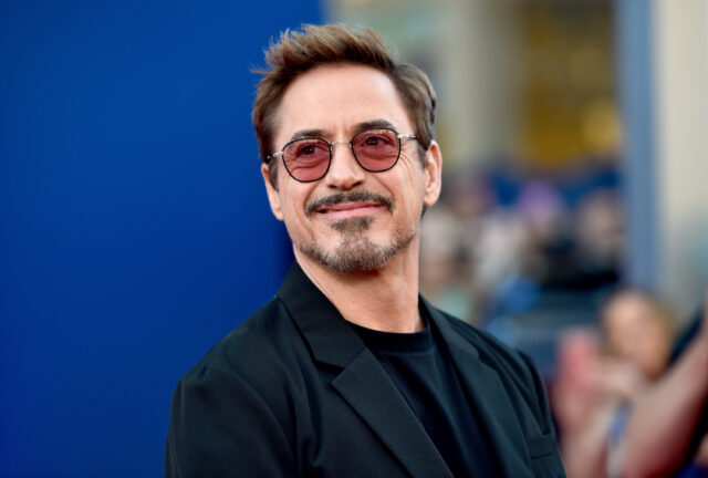 Headshot of Robert Downey Jr looking slightly to the right, wearing sunglasses.