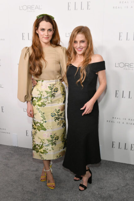 Riley Keough and Lisa Marie Presley standing together on a red carpet