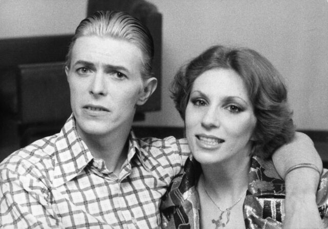 David Bowie with wife Angie in a black and white photo