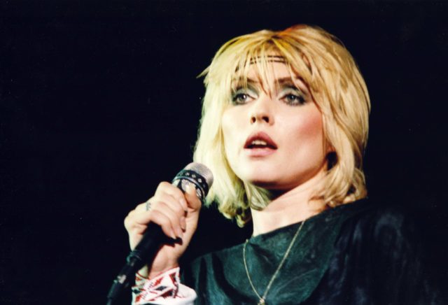 Debbie Harry of Blondie performs on stage wearing a headband