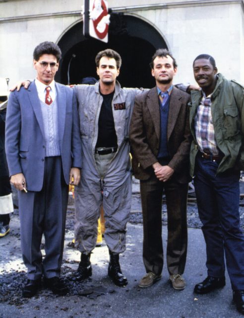 The cast of Ghostbusters in front of the fire station