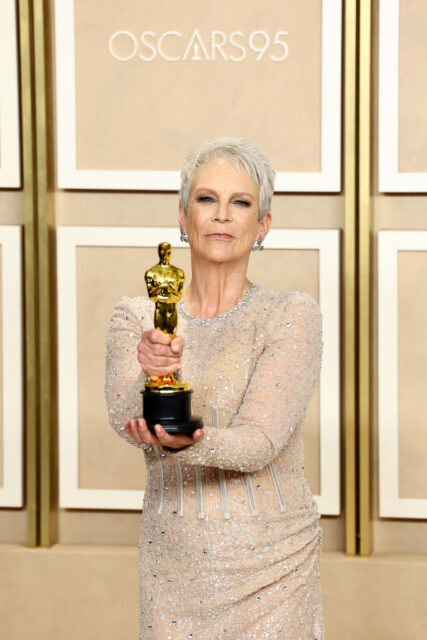 Jamie Lee Curtis holding her Oscar 