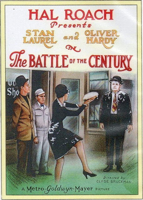 Poster for the 1927 film, The Battle of the Century, depicting a woman preparing to throw a pie at Oliver Hardy.