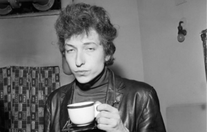 Bob Dylan holding a tea cup
