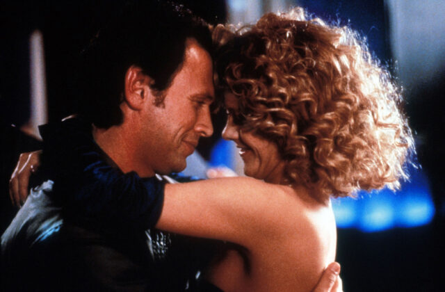 Billy Crystal and Meg Ryan hugging.