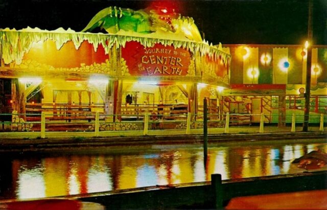 A photo of the Journey to the Center of the Earth ride at Dorney Park, lit up at night.