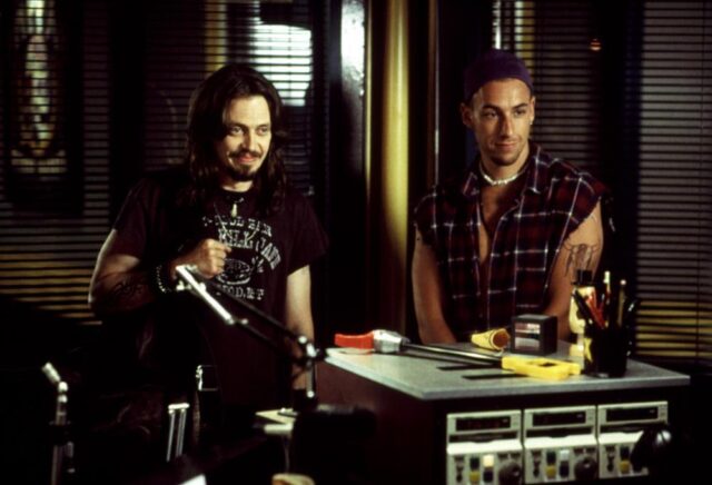 Steve Buscemi and Adam Sandler in a still from Airheads (1994).