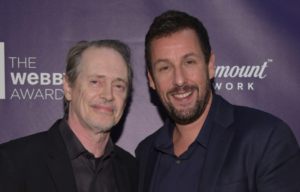 Steve Buscemi (L) and Actor Adam Sandler pose backstage at The 22nd Annual Webby Awards in New York City.