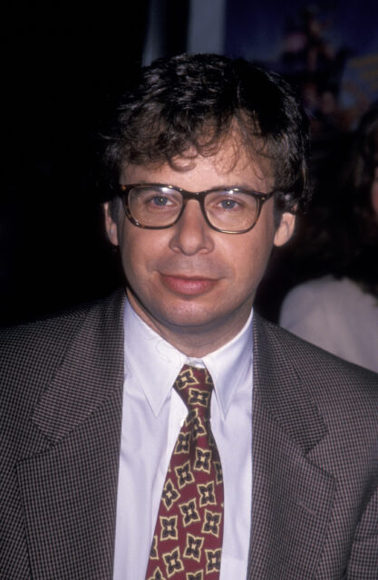 Rick Moranis posing on a red carpet