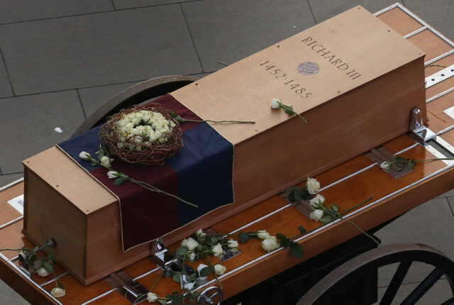 Coffin resting on a carriage