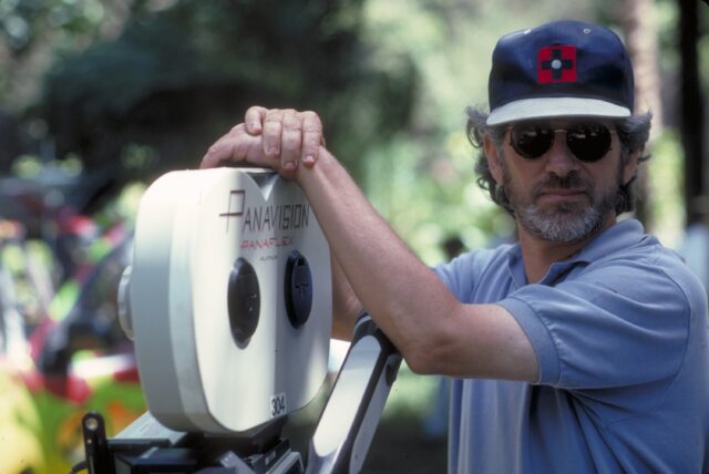 Steven Spielberg with a camera on the set of Jurassic Park.