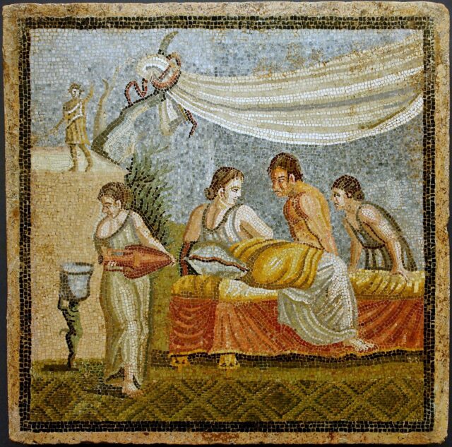 Mosaic depicting a scene of ancient sex: a woman lying on a bed while two men stand looking at her.