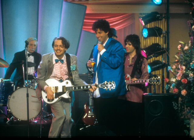 Steve Buscemi and Adam Sandler in a publicity still from the film, The Wedding Singer. 