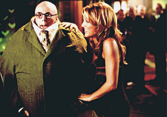 Dana Carvey dressed as Turtle Guy, Jennifer Esposito on his arm in 'The Master of Disguise.'