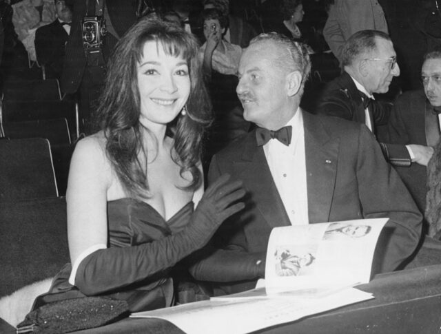 Film producer Darryl Zanuck and actress Juliette Greco at a dinner