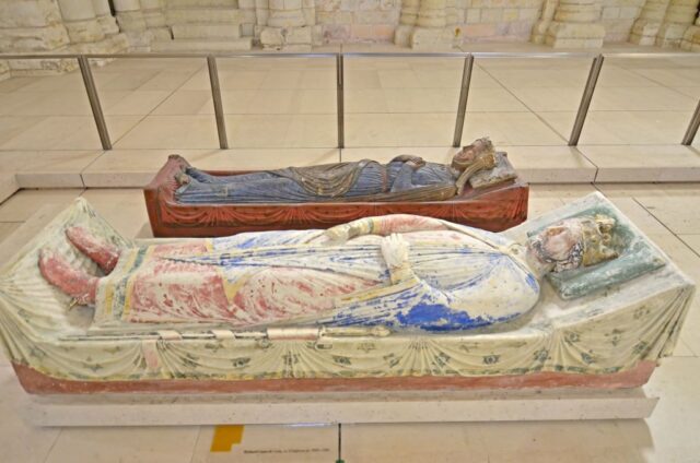 Stone casket carved with the likeness of King Richard sitting beside one carved with the likeness of Queen Isabella of England.