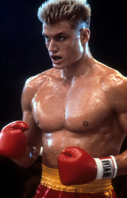 Dolph Lundgren as Ivan Drago in "Rocky IV" wearing boxing gloves.