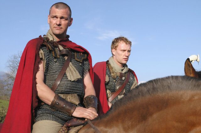 Ray Stevenson and Kevin McKidd in Roman costume riding on horses