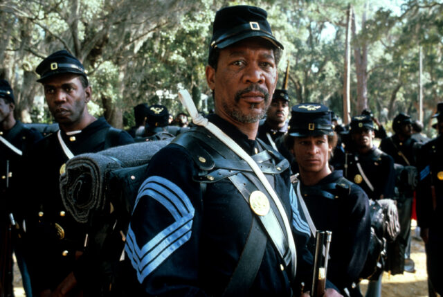 Morgan Freeman in front of several other men dressed in Civil War uniforms