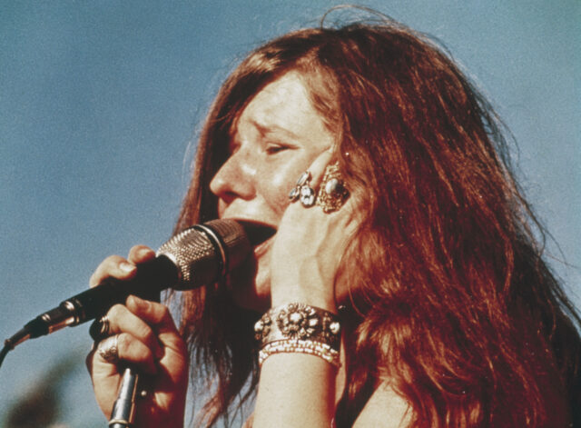 Janis Joplin sings on stage