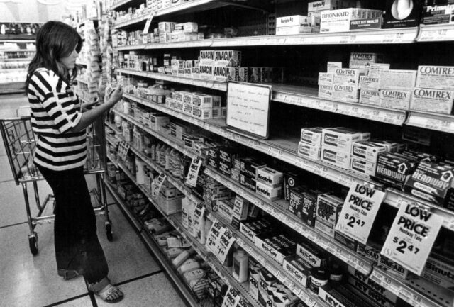 Marilyn Ball looking for medicine on a store shelf