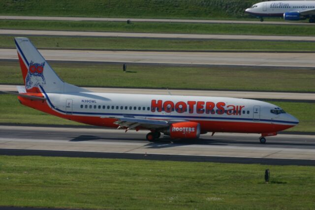 Hooters Air plane on a runway.