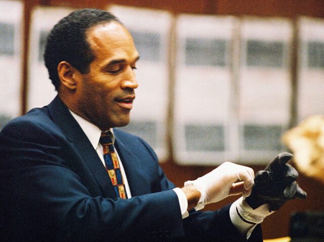 OJ Simpson tries on a glove during his trial
